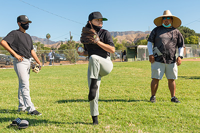 a kid practicing pitching